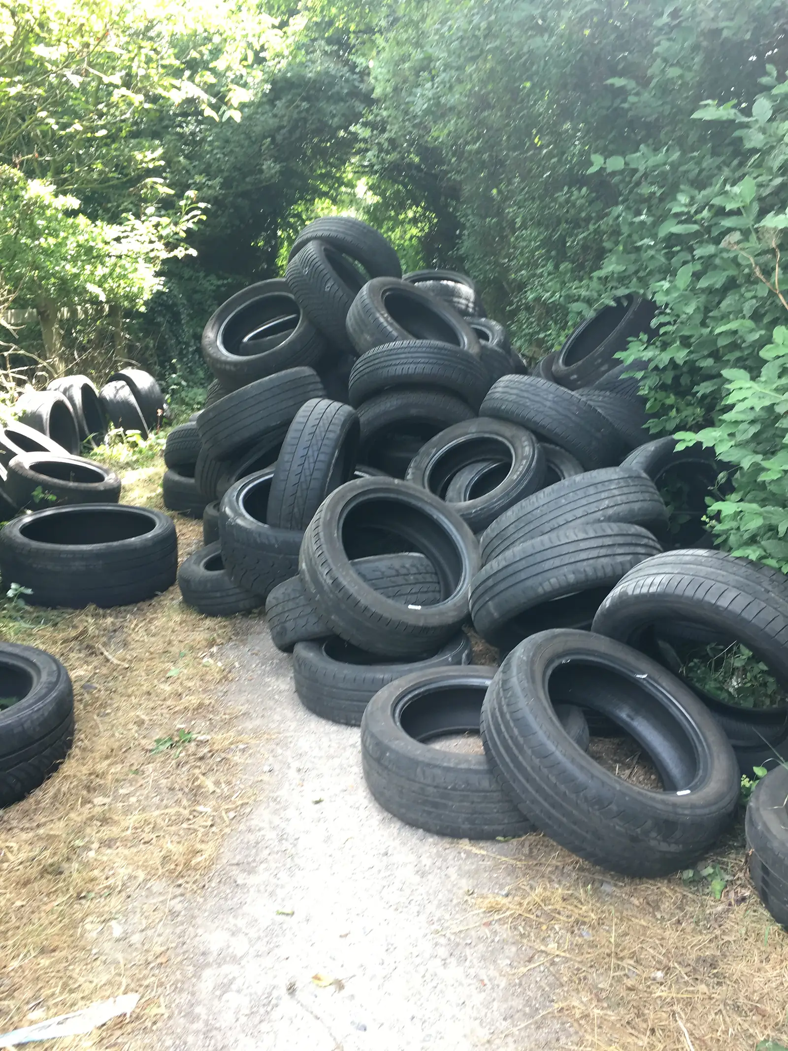 A bunch of tyres chucked onto a path