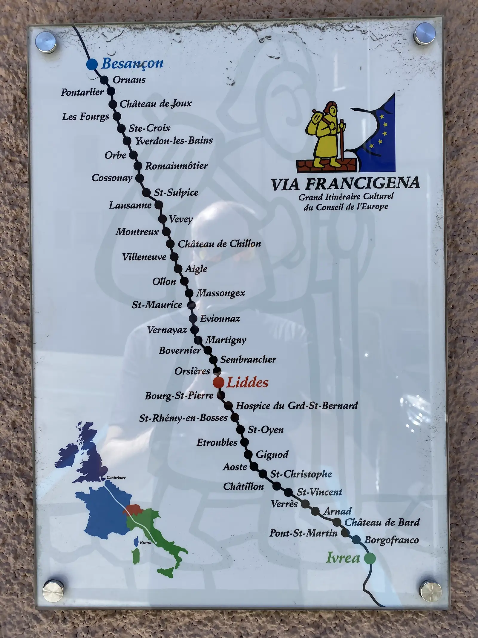 A wall-mounted Via Francigena route map showing the pilgrim path from Besançon to Rome, with Liddes marked in red among the Swiss stages.