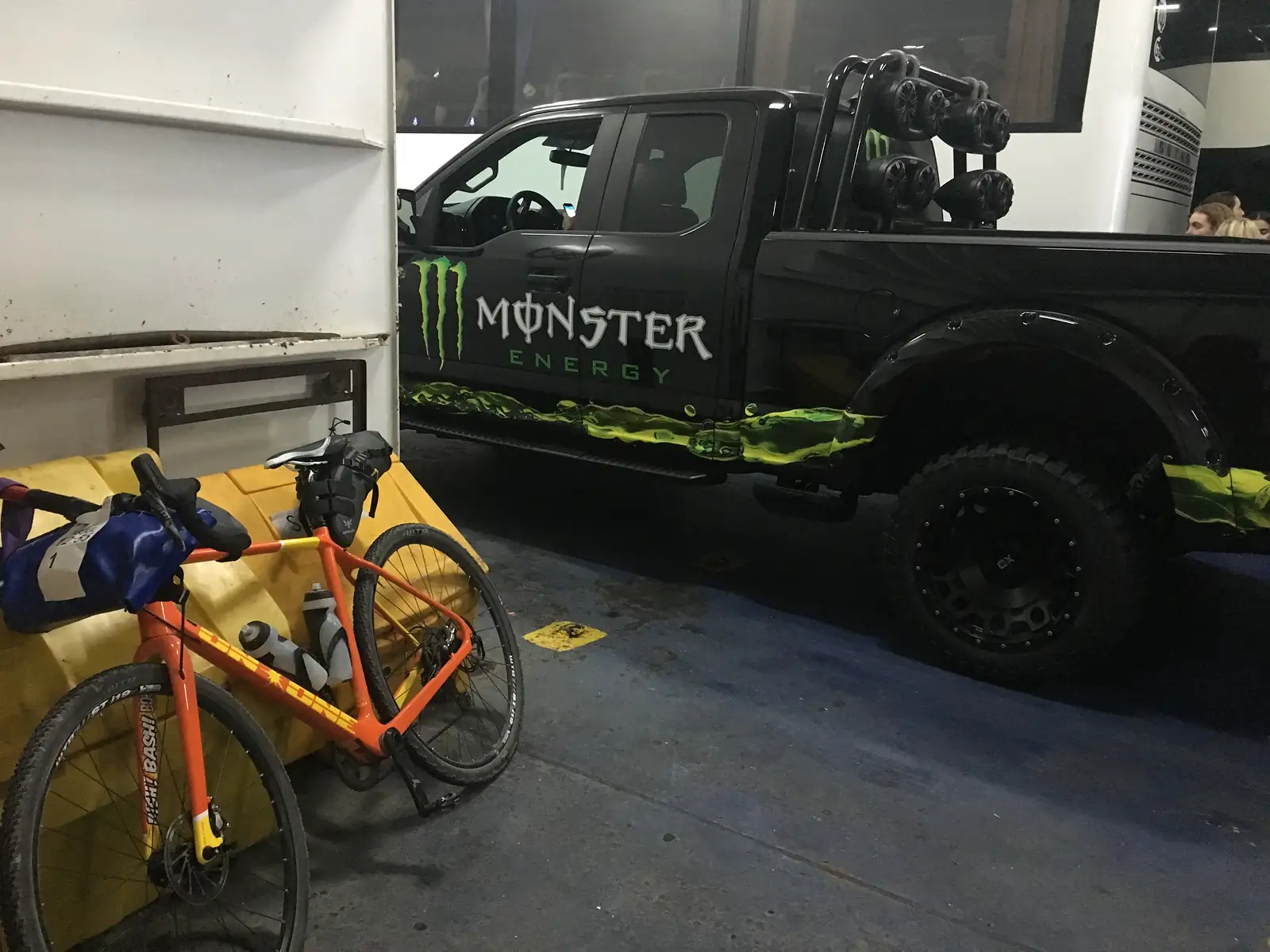 Orange bike with a truck that says Monster on it